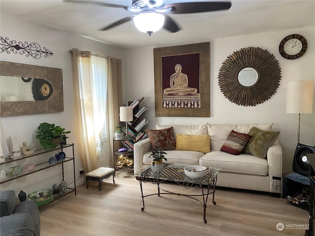 living room featuring wood finished floors and ceiling fan