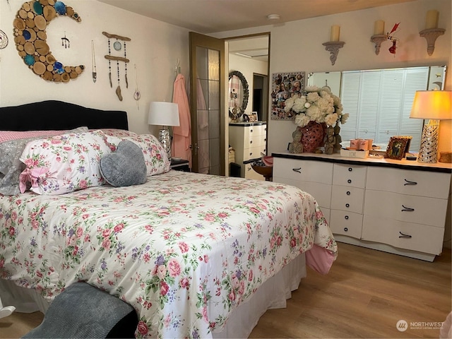 bedroom with light wood-type flooring