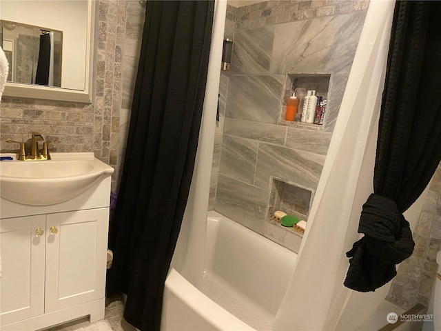 full bathroom featuring shower / tub combo with curtain and vanity