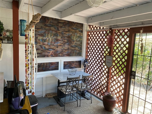 exterior space with beamed ceiling
