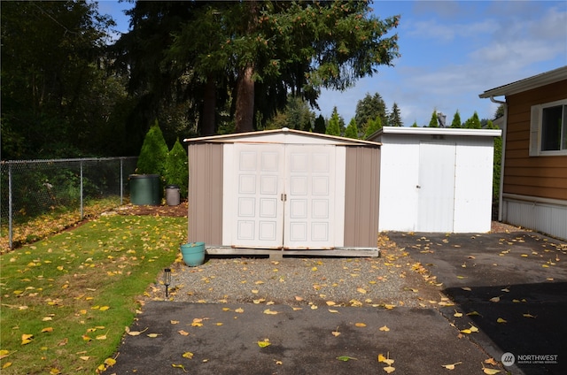 view of outdoor structure with a lawn