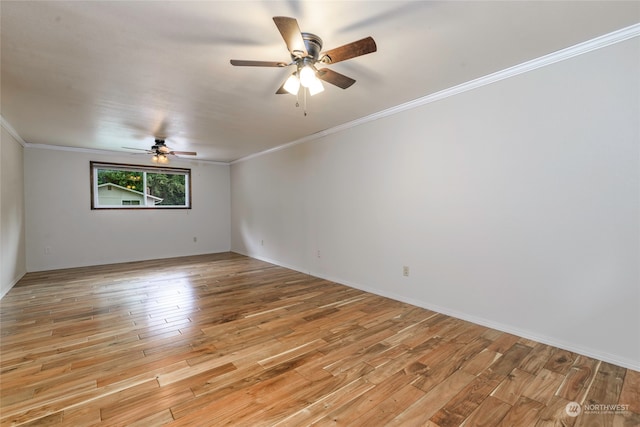 empty room with light wood-type flooring, crown molding, and ceiling fan