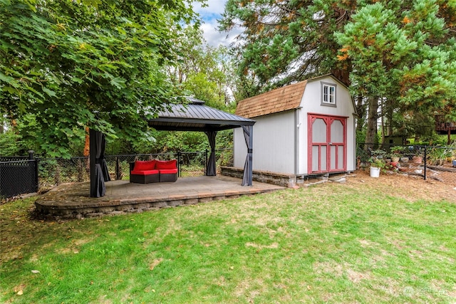 view of yard featuring a gazebo, a storage shed, and outdoor lounge area