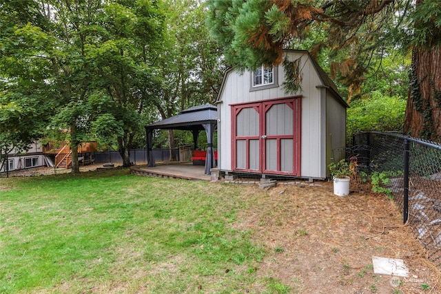 view of outdoor structure featuring a gazebo and a yard