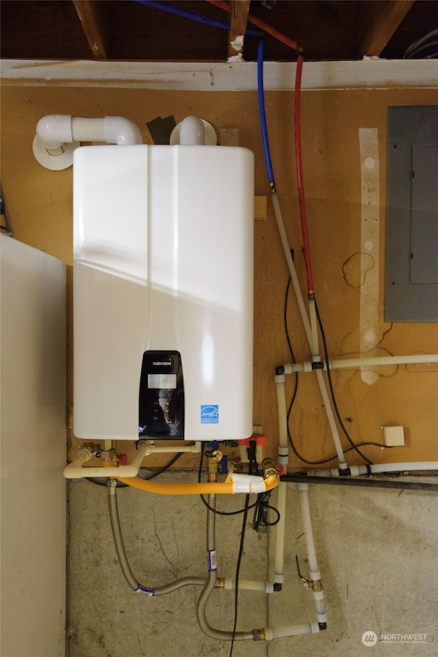 utility room with water heater and electric panel