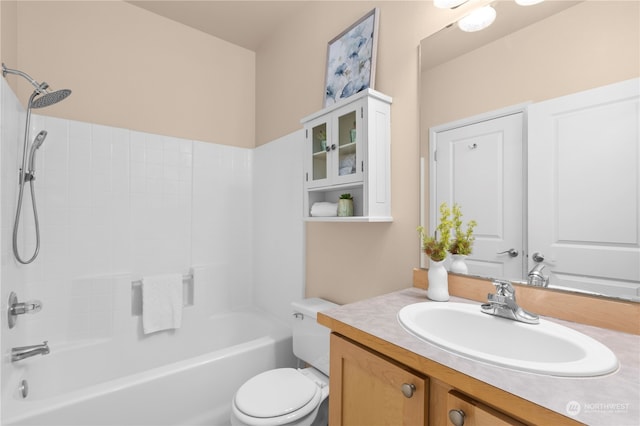 full bathroom with bathing tub / shower combination, vanity, and toilet