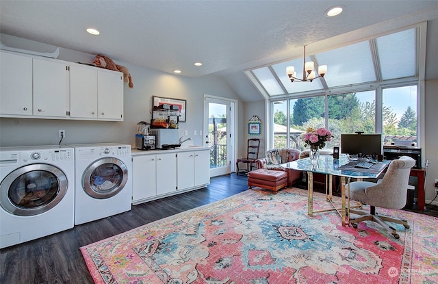 laundry area featuring cabinets, a notable chandelier, dark hardwood / wood-style floors, and washing machine and clothes dryer