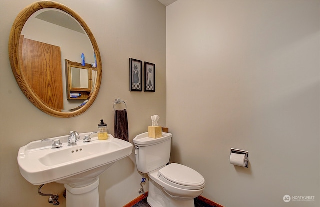 bathroom with toilet and sink