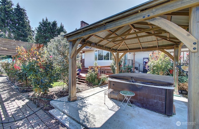 view of patio with a gazebo and a hot tub