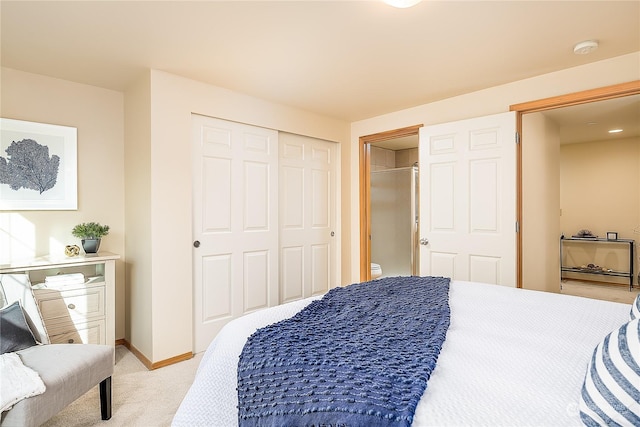 bedroom with a closet and light carpet