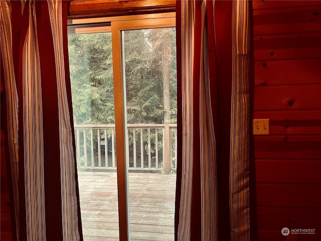 doorway to outside featuring hardwood / wood-style flooring