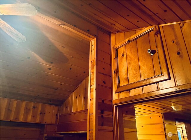 details featuring wood ceiling and wooden walls