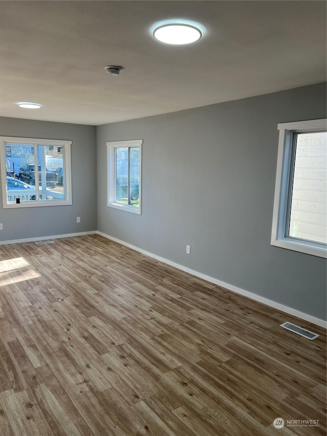 spare room featuring hardwood / wood-style floors