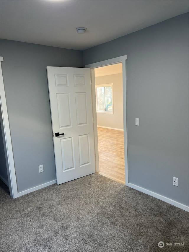 unfurnished bedroom with carpet