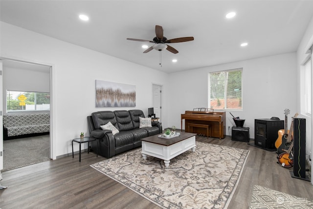 living room featuring ceiling fan and wood-type flooring