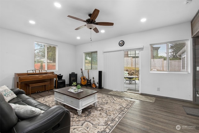 living room featuring hardwood / wood-style flooring and ceiling fan