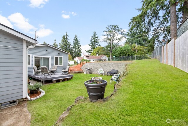 view of yard featuring a wooden deck