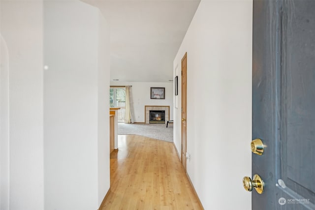 hall with light hardwood / wood-style flooring