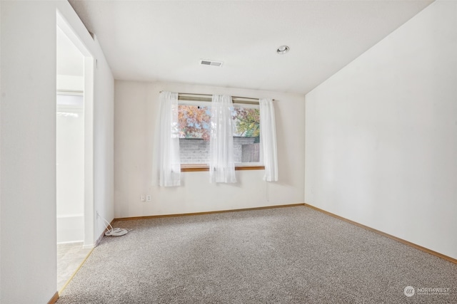 empty room featuring carpet flooring