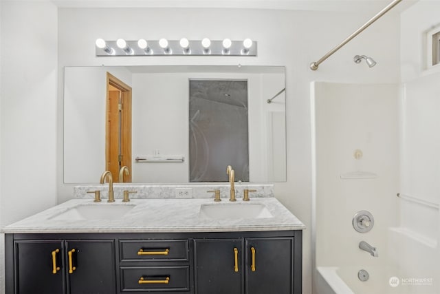 bathroom featuring vanity and shower / bath combination