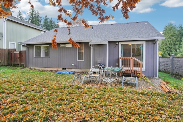 back of house featuring a yard