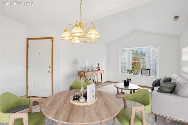 dining space with carpet flooring, a chandelier, and vaulted ceiling