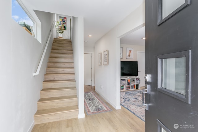 stairway with wood-type flooring