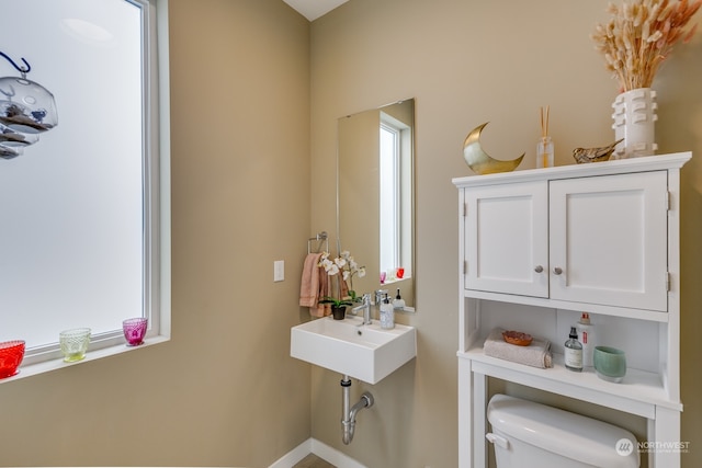 bathroom featuring sink and toilet