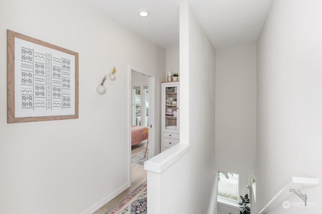 hallway featuring hardwood / wood-style flooring