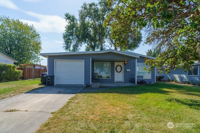 single story home with a garage and a front lawn