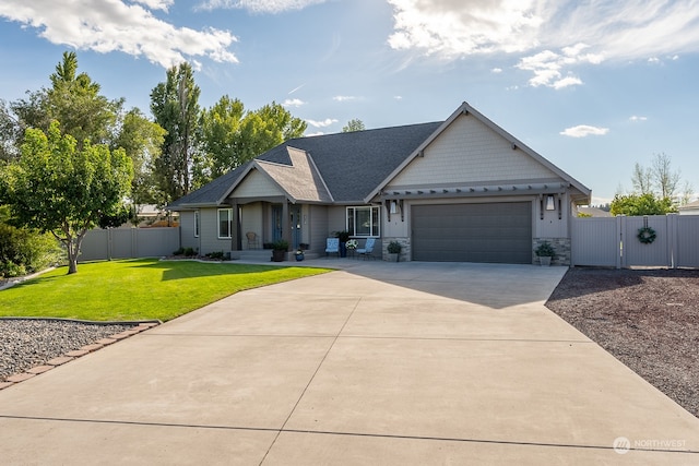 view of front of house with a garage and a front lawn