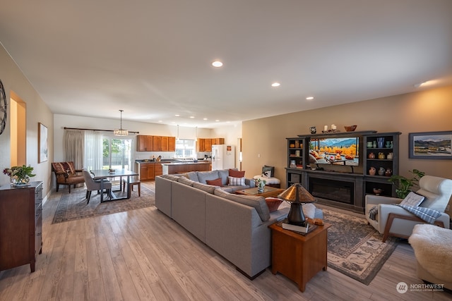 living room with light hardwood / wood-style flooring