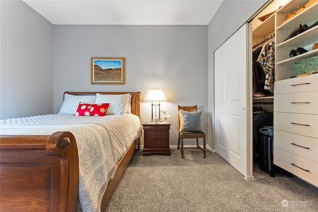 bedroom with light carpet and a closet