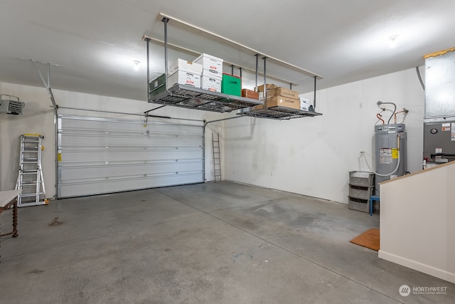 garage with a garage door opener, heating unit, and water heater