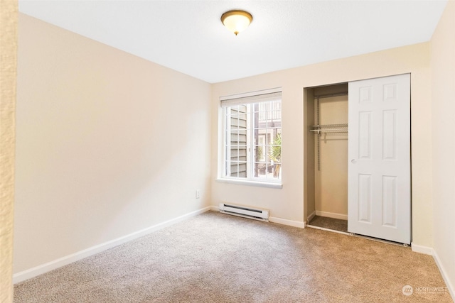 unfurnished bedroom featuring light colored carpet, a closet, and a baseboard radiator