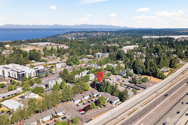 aerial view featuring a water and mountain view