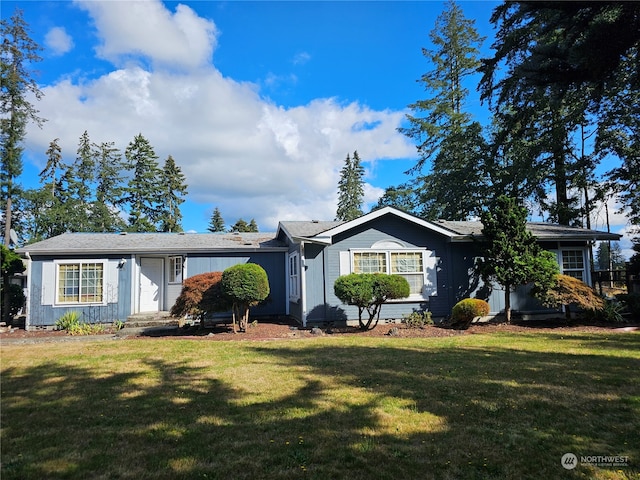 ranch-style home with a front lawn