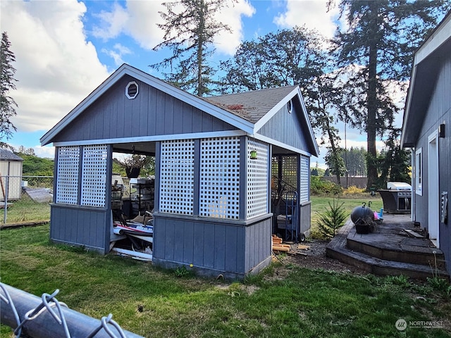 view of outbuilding with a lawn