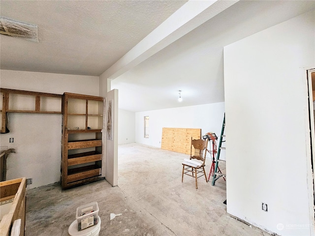 interior space featuring a textured ceiling