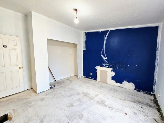 interior space featuring a textured ceiling