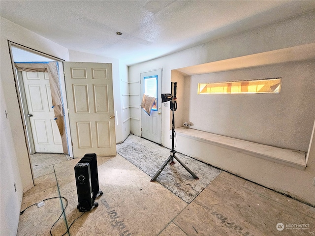 interior space featuring a textured ceiling