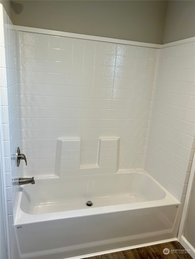 2015 6th Ave Unit 112, Clarkston, WA 99403 - full bathroom with wood finished floors, tub / shower combination, and baseboards