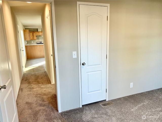 hallway featuring carpet