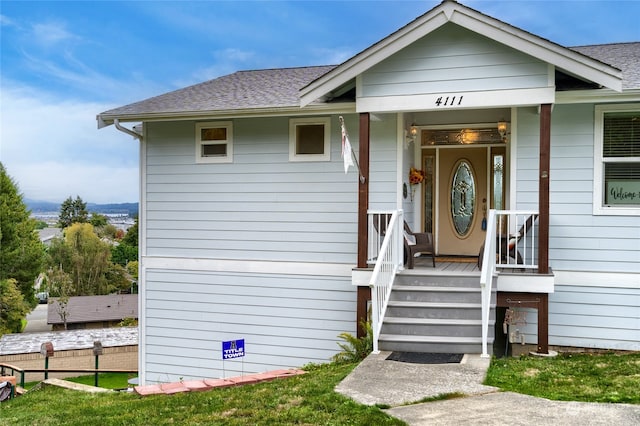 entrance to property featuring covered porch