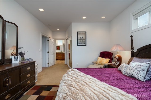 bedroom featuring light carpet