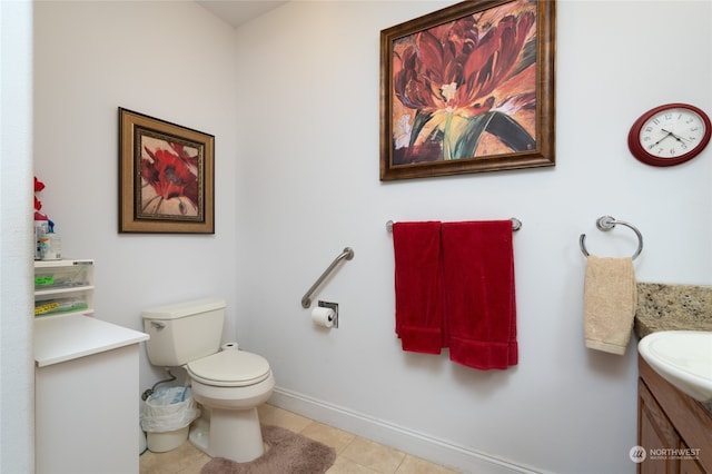 bathroom with vanity, toilet, and tile patterned floors