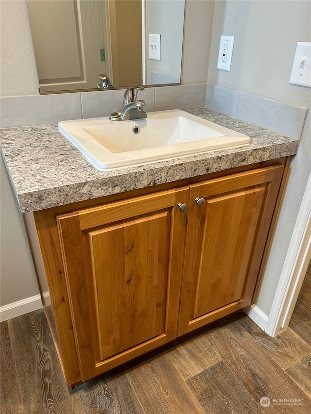 bathroom featuring vanity and hardwood / wood-style floors