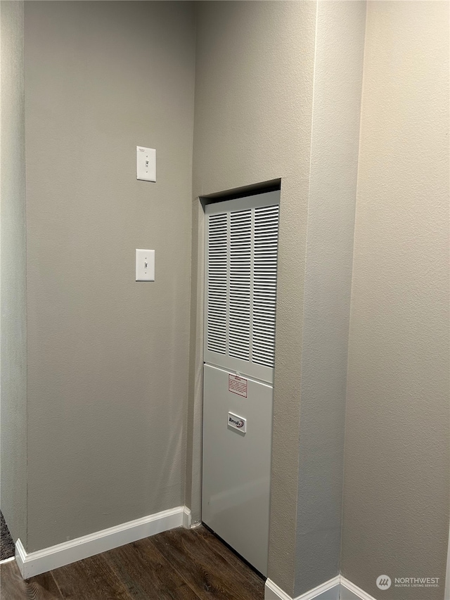 2015 6th Ave Unit 109, Clarkston, WA 99403 - detailed view of wood finished floors, baseboards, and a heating unit