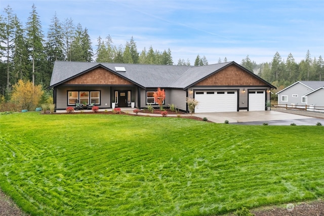 view of front facade with a front yard and a garage