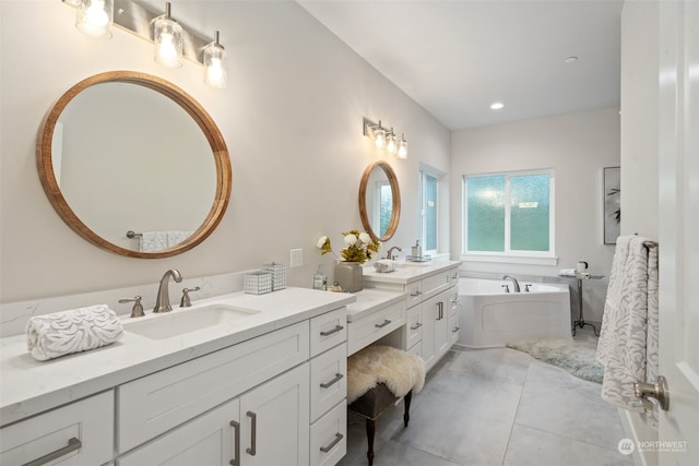 bathroom featuring a bath, tile patterned flooring, and vanity